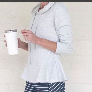 Soft gray peplum top with fun detail at bottom